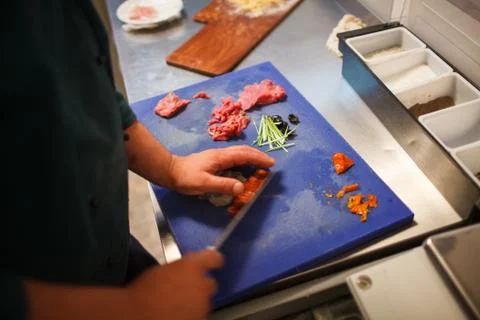 Chef cuts vegetables Stock Photos
