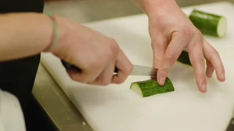 The chef cuts vegetables professionally. Professional cooking Stock Footage 232562464