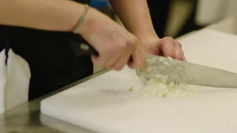 The chef cuts vegetables professionally. Professional cooking Stock Footage 232562625