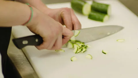 The chef cuts vegetables professionally. Professional cooking Stock Footage 232562652
