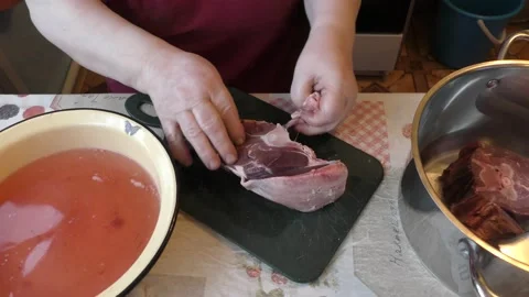 Chef cuts venison with a knife Stock Footage 169329553