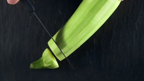 Chef cuts zucchini on the board for the vegetable ragout Video stock 143777743