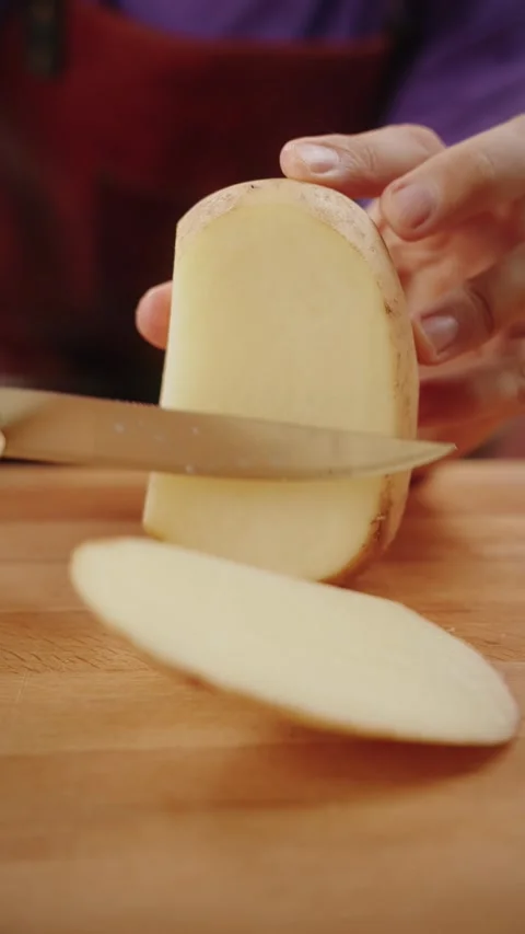Chef Cutting and Peeling Raw Potatoes Video stock 280351141