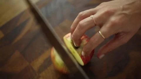 Chef cutting an apple with knife skills Stock Footage 59888012