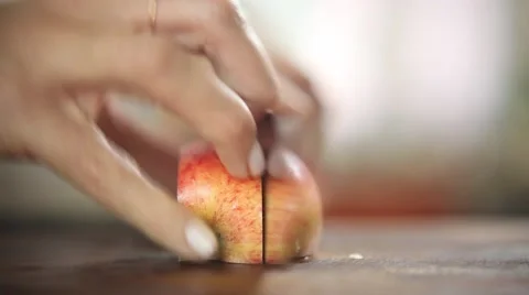 Chef cutting an apple with very low depth of field Stock Footage 59888499