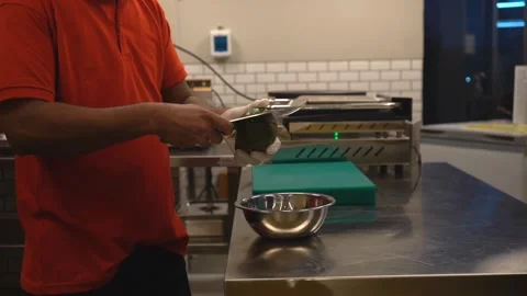 Chef cutting avacado with knife Stock Footage 229532223