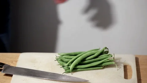 Chef cutting beans Stock Footage 109068854