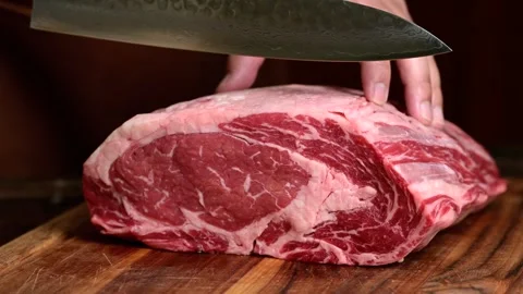Chef cutting beef steak with knife Stock Footage 263765795