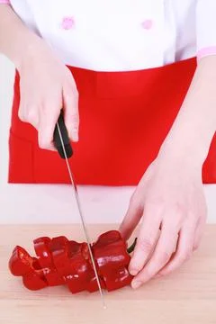 Chef cutting a bell pepper Stock Photos
