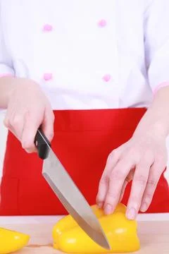 Chef cutting a bell pepper Stock Photos
