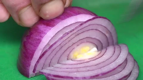 Chef cutting blue onion with a knife Stock Footage 147437745