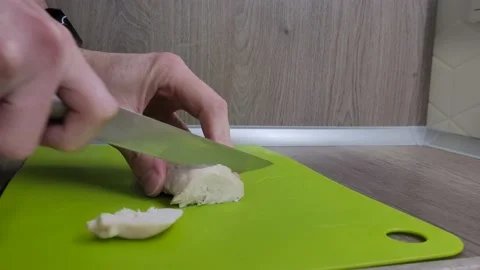 Chef cutting boiled chicken breast with knife Stock Footage 231696346