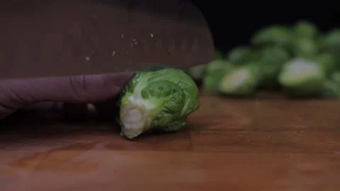 Chef cutting brussels sprouts with knife Stock Footage 149707554