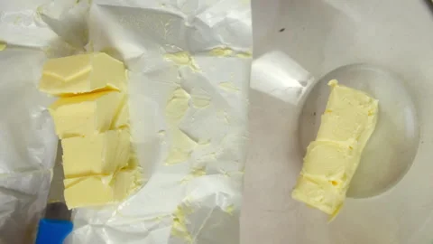 Chef cutting butter putting from block into bowl cooking cream for cake. Stock Footage 313048076