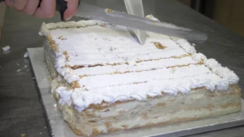 Chef Cutting the Celebration Cake Into Small Portions for Guests Stock Footage 336793710