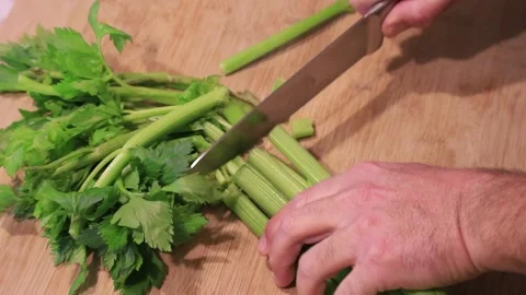 Chef cutting celery on the cutting board Stock Footage 146848855