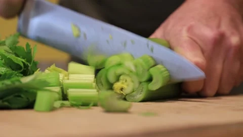 Chef cutting celery on the cutting board Stock Footage 146850188