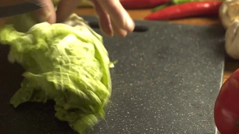 Chef cutting chinese cabbage with a knife Stock Footage 83397946