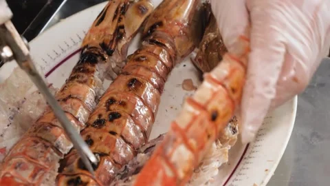 Chef Cutting Cooked Mantis Shrimp with Kitchen Scissors, Close-Up Video stock 344222715