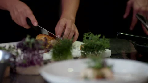 Chef cutting cooked meat at kitchen. Stock Footage 64116638