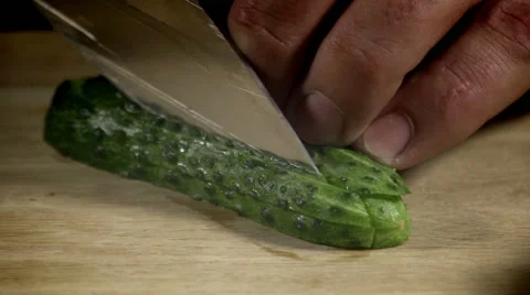Chef cutting cucumber on the board Stock Footage 65359826