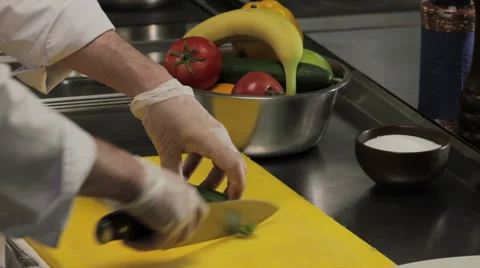 Chef cutting a cucumber Vídeos de archivo 66064911