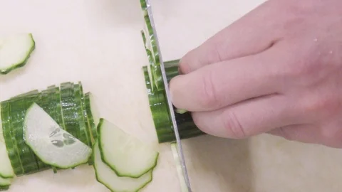 Chef cutting cucumber Video stock 104900882