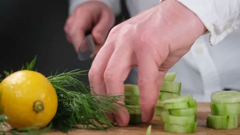 Chef cutting cucumber Stock Footage 203850502