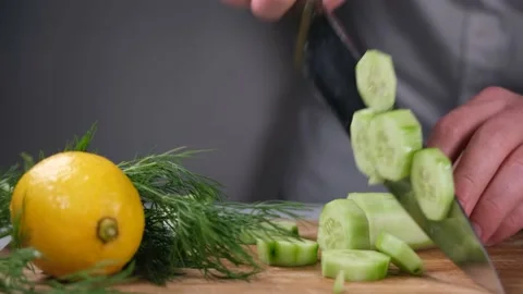 Chef cutting cucumber Stock Footage 230483167