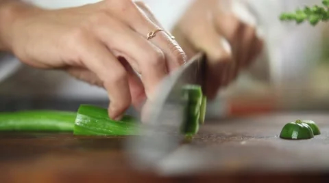 Chef cutting a cucumber with knife skills Stock Footage 59888032