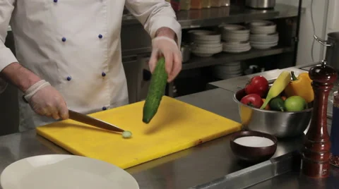 Chef cutting a cucumber, medium shot Stock Footage 66063896