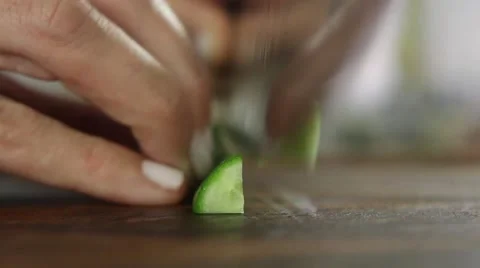 Chef cutting cucumber with shallow depth of field Stock Footage 59888573