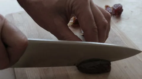 Chef cutting date with on a cutting board Stock Footage 58535587