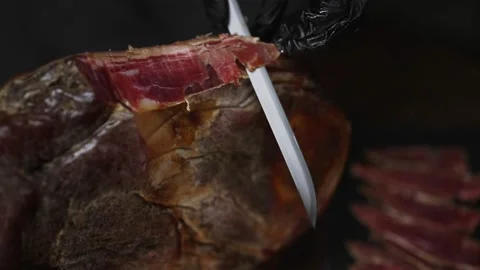 Chef cutting dry-cured spanish ham Jamon. Stock Footage 221704499