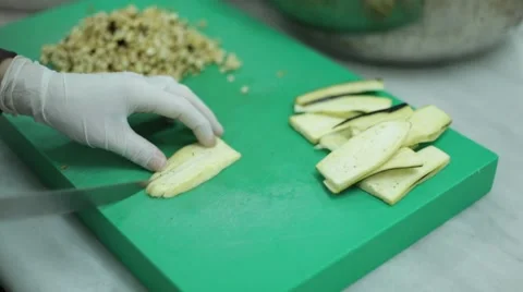 Chef Cutting Eggplant on the Board Stock Footage 61943660