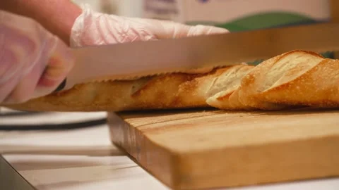 Chef cutting French bread 4K Stock Footage 157283367