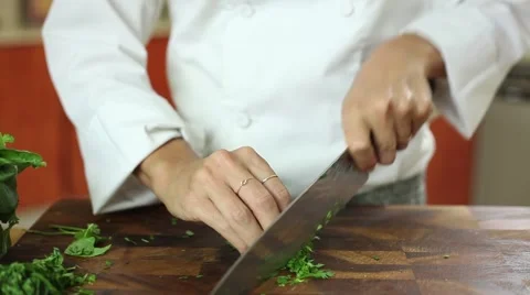 Chef cutting fresh basil with knife skills Stock Footage 59887910