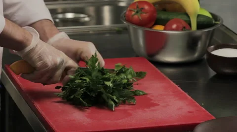 Chef cutting fresh greenery, close up 库存影片 66060001