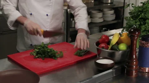 Chef cutting fresh greenery, medium shot Stock Footage 66059466