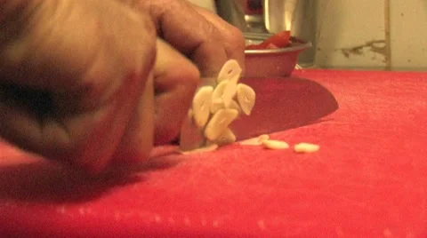 Chef cutting garlic fast Stock Footage 7138970