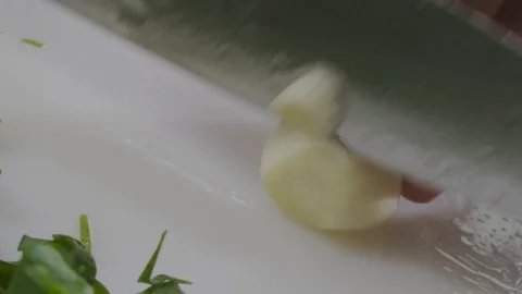 Chef cutting garlic Stock Footage 98297273