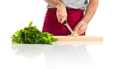 Chef cutting a garlic Stock Photos