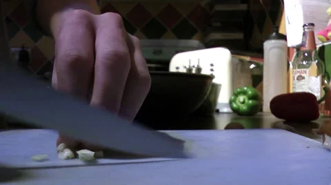 Chef cutting garlin and putting it in pan HD 50 fps Stock Footage 36203313