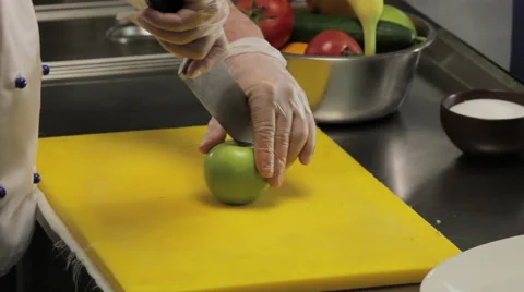 Chef cutting green apple, close up Stock-Footage 66076098