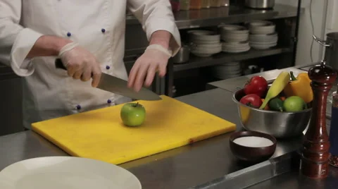 Chef cutting green apple, medium shot Stock Footage 66075545