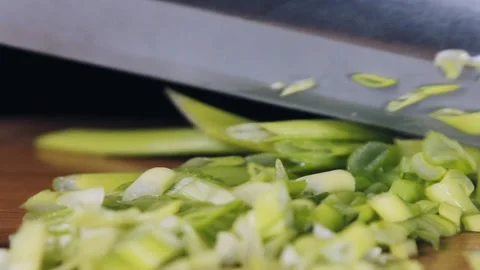 Chef cutting green onions macro shoot. Stock Footage 140484163