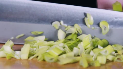 Chef cutting green onions macro shoot. Stock Footage 140489010