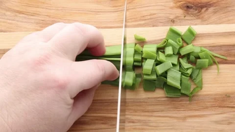 Chef Cutting Green Onions Into Small Pieces On Wooden Board Stock Footage 308666481