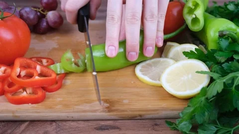 Chef cutting green pepper Stock Footage 231571340