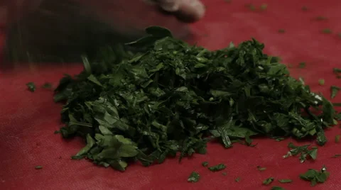 Chef cutting greenery finely, close up Stock Footage 66060229